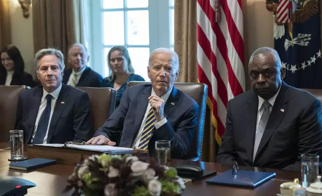 President Joe Biden flanked Secretary of State Antony Blinken, left, and Secretary of Defense Lloyd Austin, right, speaks during a meeting with the members of his cabinet and first lady Jill Biden, in the Cabinet Room of the White House, Friday, Sept. 20, 2024. (AP Photo/Manuel Balce Ceneta)