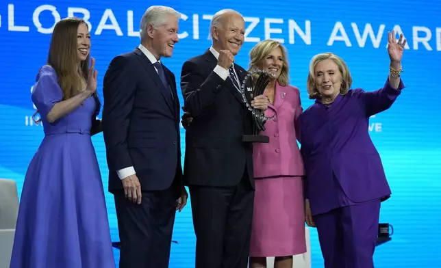 President Joe Biden is presented with the Global Citizen Award by Chelsea Clinton, former President Bill Clinton, first lady Jill Biden and former Secretary of State Hillary Clinton at the Clinton Global Initiative Monday, Sept. 23, 2024, in New York. (AP Photo/Manuel Balce Ceneta)