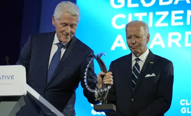 President Joe Biden is presented with the Global Citizen Award by former President Bill Clinton at the Clinton Global Initiative Monday, Sept. 23, 2024, in New York. (AP Photo/Manuel Balce Ceneta)