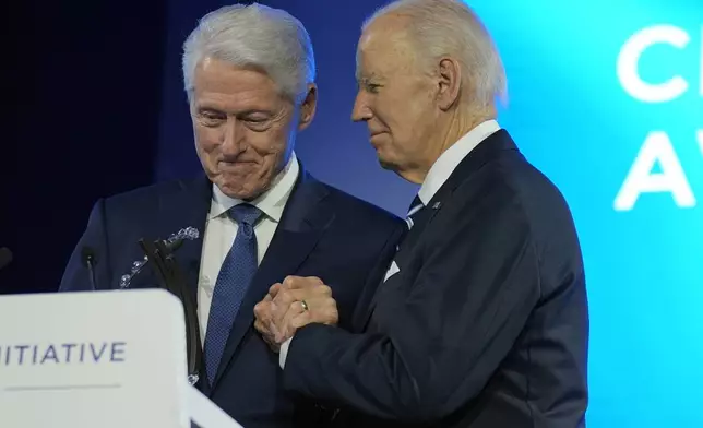 President Joe Biden is presented with the Global Citizen Award by former President Bill Clinton at the Clinton Global Initiative Monday, Sept. 23, 2024, in New York. (AP Photo/Manuel Balce Ceneta)