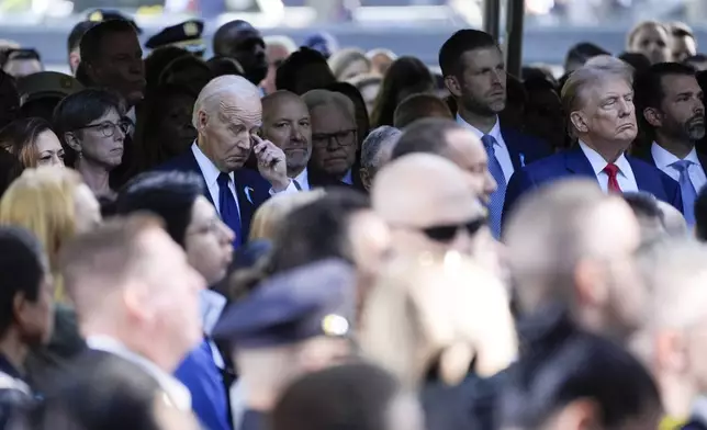 President Joe Biden and Democratic presidential nominee Vice President Kamala Harris, left, and Republican presidential nominee former President Donald Trump, right, attend a ceremony marking the anniversary of the Sept. 11 terror attacks at the National September 11 Memorial &amp; Museum, Wednesday, Sept. 11, 2024, in New York. (AP Photo/Evan Vucci)