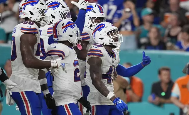 Buffalo Bills cornerback Christian Benford (47) celebrates an interception during the first half of an NFL football game against the Miami Dolphins, Thursday, Sept. 12, 2024, in Miami Gardens, Fla. (AP Photo/Rebecca Blackwell)