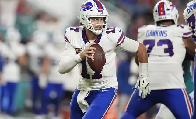 Buffalo Bills quarterback Josh Allen (17) looks to pass the ball during the first half of an NFL football game against the Miami Dolphins, Thursday, Sept. 12, 2024, in Miami Gardens, Fla. (AP Photo/Rebecca Blackwell)