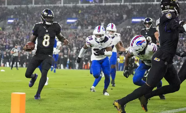 Baltimore Ravens quarterback Lamar Jackson (8) runs for a touchdown against the Buffalo Bills during the second half of an NFL football game, Sunday, Sept. 29, 2024, in Baltimore. (AP Photo/Stephanie Scarbrough)