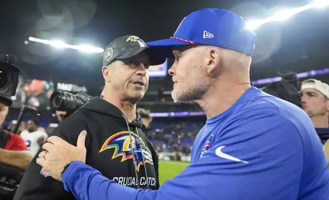 Baltimore Ravens head coach John Harbaugh, left, talks with Buffalo Bills head coach Sean McDermott following an NFL football game, Sunday, Sept. 29, 2024, in Baltimore. The Ravens won 35-10. (AP Photo/Stephanie Scarbrough)