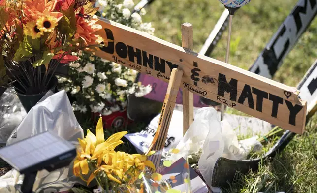 A memorial for Johnny and Matthew Gaudreau, who died last week when they were struck by a suspected drunken driver while riding bicycles, is shown in Salem County, N.J, Wednesday, Sept. 4, 2024.(Jessica Griffin/The Philadelphia Inquirer via AP)