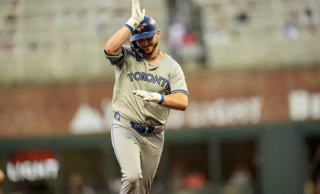 Toronto Blue Jays' Spencer Horwitz (48) celebrates his solo homer against the Atlanta Braves in the first inning of a baseball game, Saturday, Sept. 7, 2024, in Atlanta.(AP Photo/Mike Stewart)