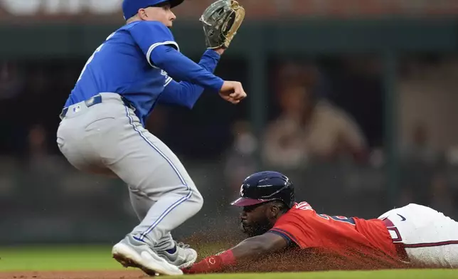 Atlanta Braves' Michael Harris II attempts to steal second base before being tagged out by Toronto Blue Jays third base Will Wagner (7) in the second inning of a baseball game Friday Sept. 6, 2024, in Atlanta. (AP Photo/John Bazemore)