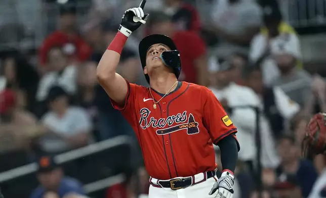 Atlanta Braves' Gio Urshela gestures after driving in a run with a single in the second inning of a baseball game against the Toronto Blue Jays Friday, Sept. 6, 2024, in Atlanta. (AP Photo/John Bazemore)