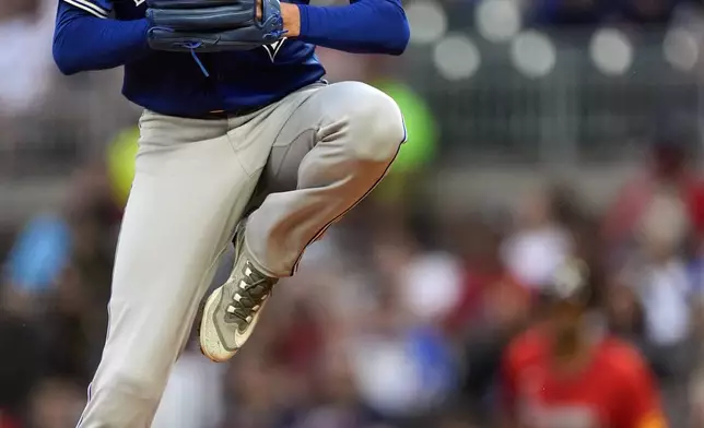 Toronto Blue Jays starting pitcher Kevin Gausman delivers in the first inning of a baseball game against the Atlanta Braves Friday, Sept. 6, 2024, in Atlanta. (AP Photo/John Bazemore)