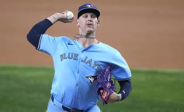 Toronto Blue Jays starting pitcher Bowden Francis throws to the Texas Rangers in the first inning of a baseball game in Arlington, Texas, Wednesday, Sept. 18, 2024. (AP Photo/Tony Gutierrez)