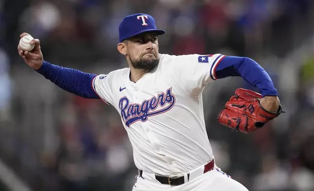 Texas Rangers starting pitcher Nathan Eovaldi throws to the Toronto Blue Jays in the first inning of a baseball game in Arlington, Texas, Tuesday, Sept. 17, 2024. (AP Photo/Tony Gutierrez)