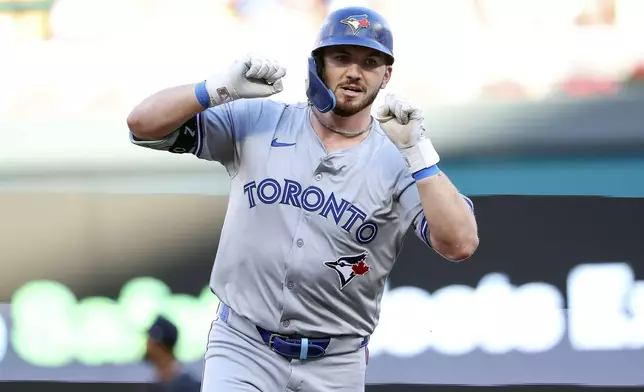 Toronto Blue Jays designated hitter Spencer Horwitz celebrates after his two-run home run while he runs the bases during the first inning of a baseball game against the Minnesota Twins, Saturday, Aug. 31, 2024, in Minneapolis. (AP Photo/Matt Krohn)