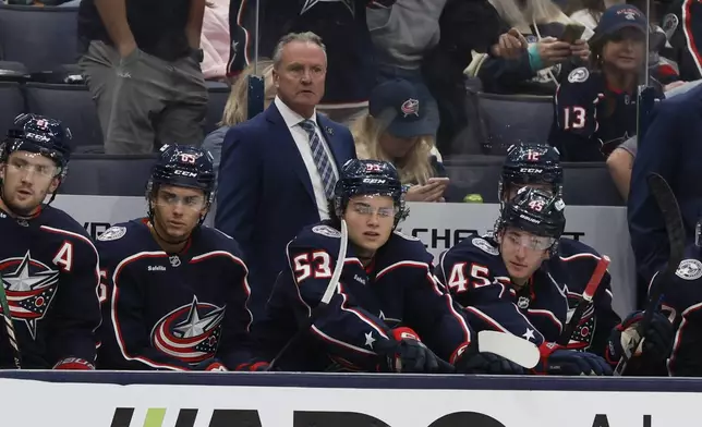 Columbus Blue Jackets head coach Dean Evason watches his team play against the St. Louis Blues during the third period of a preseason NHL preseason hockey game Wednesday, Sept. 25, 2024, in Columbus, Ohio. (AP Photo/Jay LaPrete)