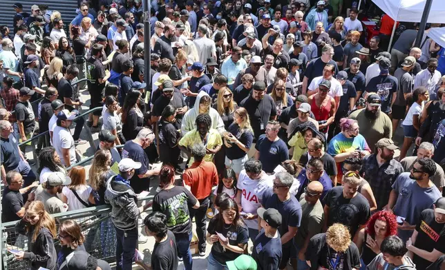 FILE - Thousands of Boeing machinists make their way to the exits to cast their vote after the "stop work meeting" and strike sanction at T-Mobile Park in Seattle, July 17, 2024. (Kevin Clark/The Seattle Times via AP, File)