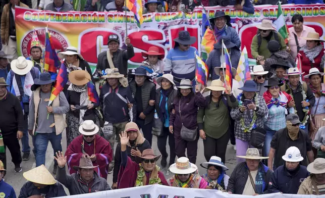 Former President Evo Morales, third from left in the front row, marches to the capital with supporters to protest the government of current President Luis Arce, near El Alto, Bolivia, Sunday, Sept. 22, 2024. (AP Photo/Juan Karita)