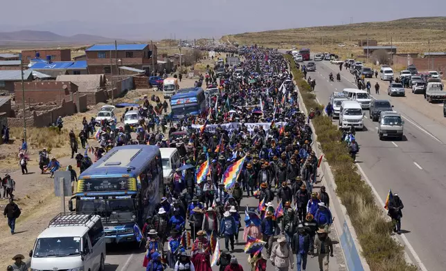 Supporters of former President Evo Morales march to the capital to protest against the government of current President Luis Arce in an escalation of a political dispute between the two politicians, in Vila Vila, Bolivia Tuesday, Sept. 17, 2024. (AP Photo/Juan Karita)