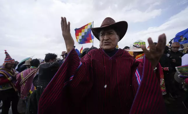 Former President Evo Morales, center, marches to La Paz with supporters to protest current President Luis Arce, near El Alto, Bolivia, Sunday, Sept. 22, 2024. (AP Photo/Juan Karita)