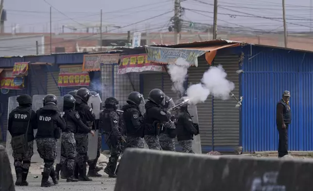 Police fire tear gas during clashes between supporters of former President Evo Morales and current President Luis Arce in El Alto, Bolivia, Sunday, Sept. 22, 2024. (AP Photo/Juan Karita)