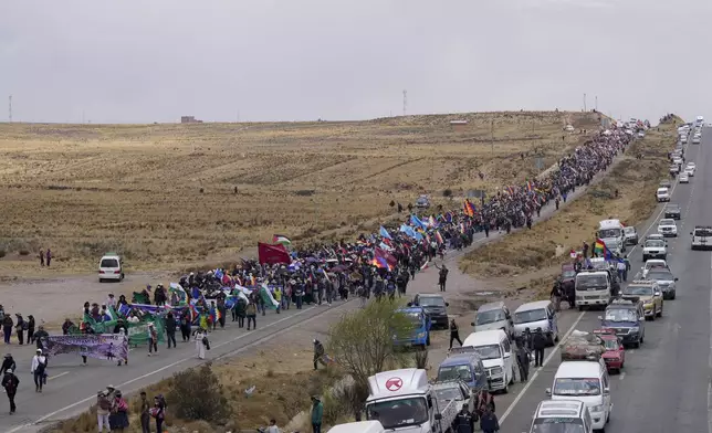 Supporters of former President Evo Morales march to the capital to protest the government of current President Luis Arce near El Alto, Bolivia, Sunday, Sept. 22, 2024. (AP Photo/Juan Karita)