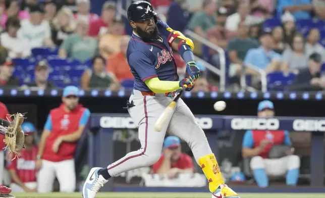 Atlanta Braves' Marcell Ozuna hits a single to left field during the third inning of a baseball game against the Miami Marlins, Saturday, Sept. 21, 2024, in Miami. (AP Photo/Marta Lavandier)