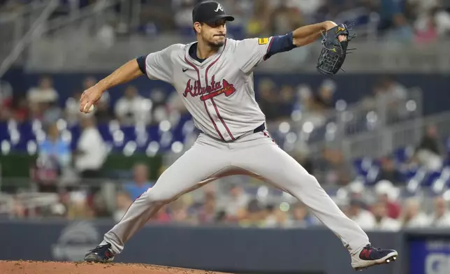 Atlanta Braves pitcher Charlie Morton (50) aims a pitch during the first inning of a baseball game against the Miami Marlins, Friday, Sept. 20, 2024, in Miami. (AP Photo/Marta Lavandier)