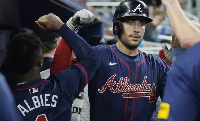 Atlanta Braves' Matt Olson celebrates a two-run home run during the seventh inning of a baseball game against the Miami Marlins, Saturday, Sept. 21, 2024, in Miami. (AP Photo/Marta Lavandier)