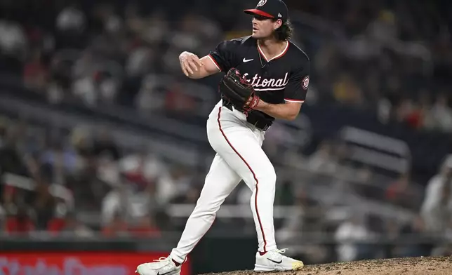 Washington Nationals relief pitcher Kyle Finnegan follows through on a pitch during the ninth inning of a baseball game against the Atlanta Braves, Wednesday, Sept. 11, 2024, in Washington. (AP Photo/John McDonnell)