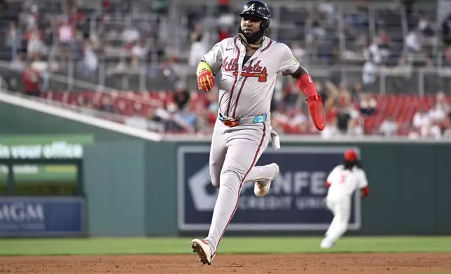 Atlanta Braves' Marcell Ozuna advances to third base on a Braves' Matt Olson RBI double during the third inning of a baseball game against the Washington Nationals, Tuesday, Sept. 10, 2024, in Washington. (AP Photo/John McDonnell)