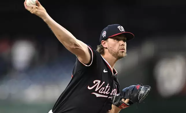 Washington Nationals starting pitcher Jake Irvin throws during the second inning of a baseball game against the Atlanta Braves, Wednesday, Sept. 11, 2024, in Washington. (AP Photo/John McDonnell)