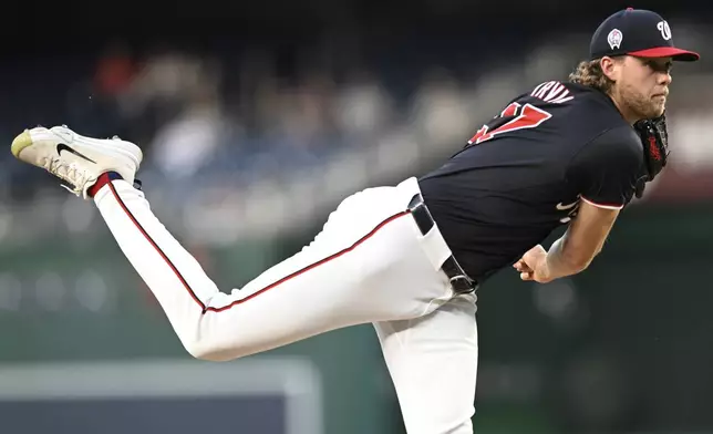 Washington Nationals starting pitcher Jake Irvin follows through during the second inning of a baseball game against the Atlanta Braves, Wednesday, Sept. 11, 2024, in Washington. (AP Photo/John McDonnell)