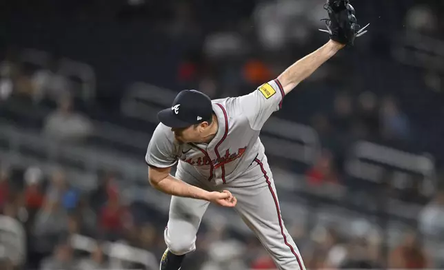 Atlanta Braves relief pitcher Luke Jackson follows through during the eighth inning of a baseball game against the Washington Nationals, Tuesday, Sept. 10, 2024, in Washington. (AP Photo/John McDonnell)