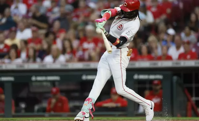 Cincinnati Reds' Elly De La Crux hits a double against the Atlanta Braves during the first inning of a baseball game Tuesday, Sept. 17, 2024, in Cincinnati. (AP Photo/Jay LaPrete)