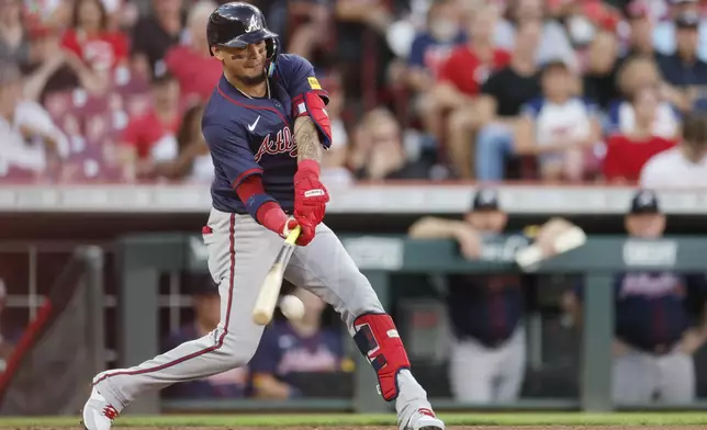 Atlanta Braves' Orlando Arcia hits a ground ball against the Cincinnati Reds during the third inning of a baseball game, Wednesday, Sept. 18, 2024, in Cincinnati. (AP Photo/Jay LaPrete)