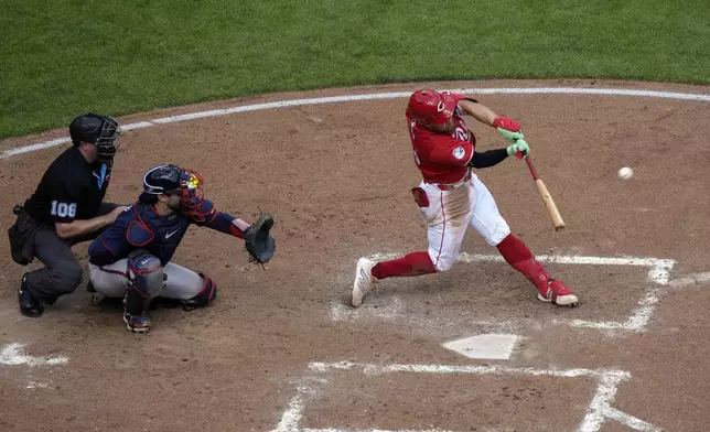 Cincinnati Reds' Blake Dunn hits a solo home run during the fifth inning of a baseball game against the Atlanta Braves, Thursday, Sept. 19, 2024, in Cincinnati. (AP Photo/Joshua A. Bickel)