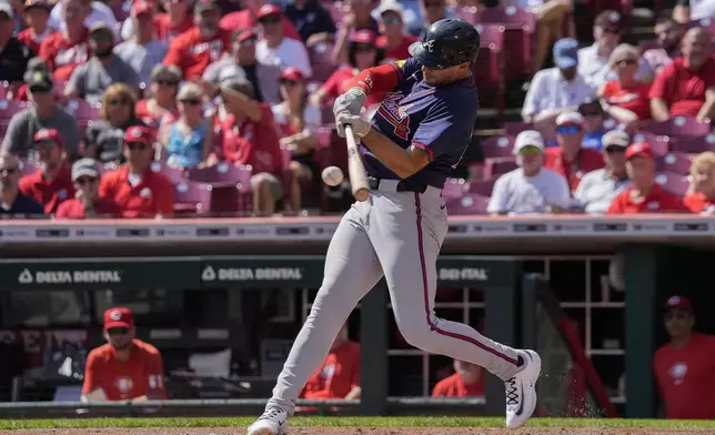 Atlanta Braves' Matt Olson hits a solo home run during the second inning of a baseball game against the Cincinnati Reds, Thursday, Sept. 19, 2024, in Cincinnati. (AP Photo/Joshua A. Bickel)