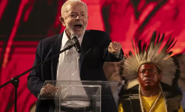 Brazil's President Luiz Inacio Lula da Silva speaks during a ceremony celebrating the return of the Indigenous Tupinamba people's sacred cloak to Brazil, in Rio de Janeiro, Thursday, Sept. 12, 2024. The garment, made from bird feathers and plant fibers, was repatriated to Brazil after having spent more than 300 years in the National Museum of Denmark. (AP Photo/Bruna Prado)