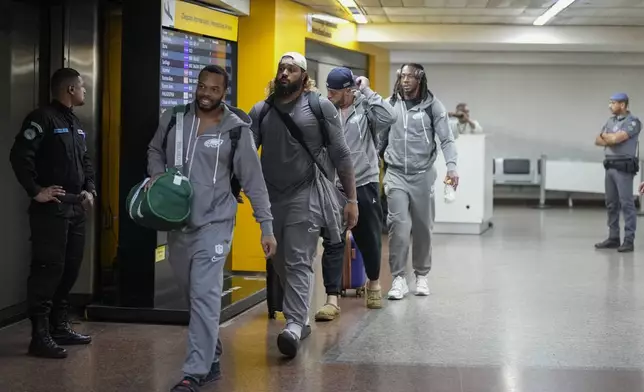 Philadelphia Eagles players arrive at Sao Paulo International airport ahead of a game against the Philadelphia Eagles, in Guarulhos, greater Sao Paulo, Brazil, Wednesday, Sept. 4, 2024. (AP Photo/Andre Penner)