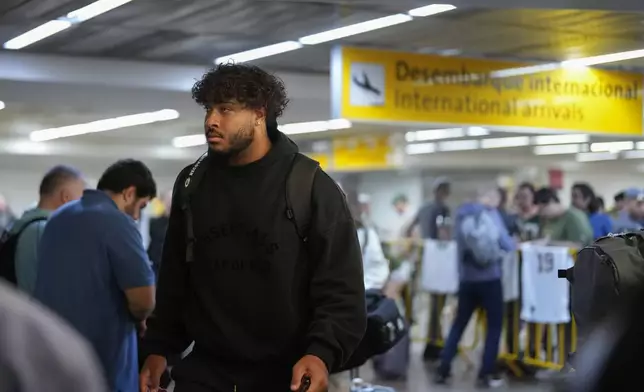 The Green Bay Packers' Jordan Morgan arrives at Sao Paulo International airport ahead of a game against the Philadelphia Eagles, in Guarulhos, greater Sao Paulo, Brazil, Wednesday, Sept. 4, 2024. (AP Photo/Andre Penner)