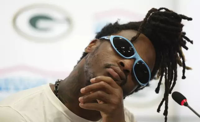 Green Bay Packers safety Xavier McKinney stretches his neck during a news conference after a practice session in Sao Paulo, Brazil, Thursday, Sept. 5, 2024, ahead of a game with the Philadelphia Eagles on Friday. (AP Photo/Fernando Llano)