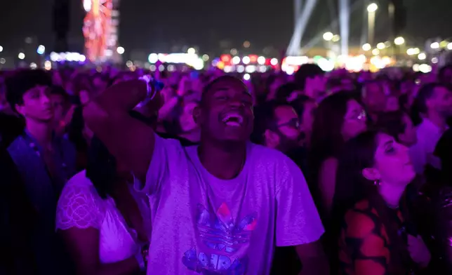 Henrique Miranda da Silva Martins, 24, who is deaf, reacts during a performance at the Rock in Rio music festival in Rio de Janeiro, Saturday, Sept. 21, 2024. (AP Photo/Bruna Prado)