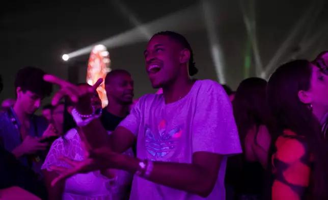 Henrique Miranda da Silva Martins, 24, who is deaf, reacts during a performance at the Rock in Rio music festival in Rio de Janeiro, Saturday, Sept. 21, 2024. (AP Photo/Bruna Prado)