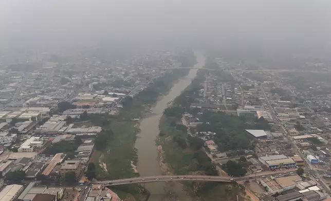 Clouds of smoke caused by wildfires hover over Rio Branco, Brazil, Wednesday, Sept. 4, 2024. (AP Photo/Marcos Vicentti)