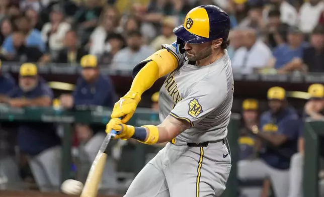 Milwaukee Brewers' Garrett Mitchell hits a single against the Arizona Diamondbacks during the first inning of a baseball game, Saturday, Sept. 14, 2024, in Phoenix. (AP Photo/Darryl Webb)