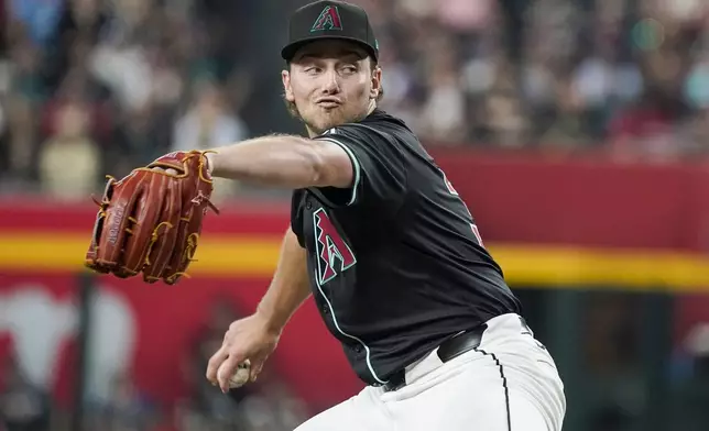 Arizona Diamondbacks pitcher Brandon Pfaadt (32) throws against the Milwaukee Brewers during the first inning of a baseball game, Saturday, Sept. 14, 2024, in Phoenix. (AP Photo/Darryl Webb)