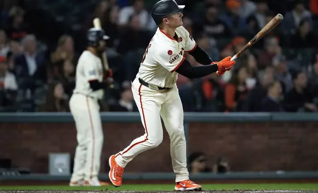 San Francisco Giants' Matt Chapman watches his solo home run during the fourth inning of a baseball game against the Milwaukee Brewers, Wednesday, Sept. 11, 2024, in San Francisco. (AP Photo/Godofredo A. Vásquez)