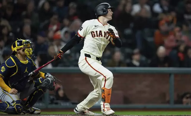 San Francisco Giants' Mike Yastrzemski watches his RBI double during the fourth inning of a baseball game against the Milwaukee Brewers, Wednesday, Sept. 11, 2024, in San Francisco. (AP Photo/Godofredo A. Vásquez)