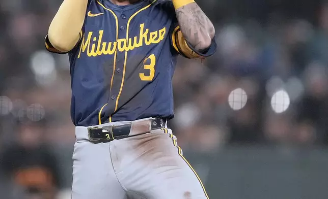 Milwaukee Brewers' Joey Ortiz gestures after hitting a triple against the San Francisco Giants during the seventh inning of a baseball game Tuesday, Sept. 10, 2024, in San Francisco. (AP Photo/Tony Avelar)