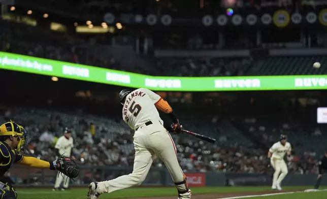 San Francisco Giants' Mike Yastrzemski (5) hits a three-run home run during the second inning of a baseball game against the Milwaukee Brewers, Wednesday, Sept. 11, 2024, in San Francisco. (AP Photo/Godofredo A. Vásquez)