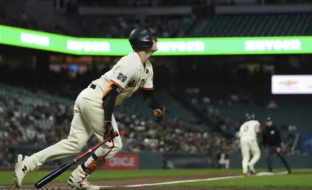 San Francisco Giants' Mike Yastrzemski watches his three-run home run during the second inning of a baseball game against the Milwaukee Brewers, Wednesday, Sept. 11, 2024, in San Francisco. (AP Photo/Godofredo A. Vásquez)